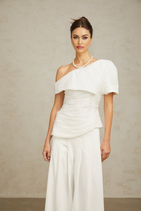 Adele white matching set featuring a creased top and trousers