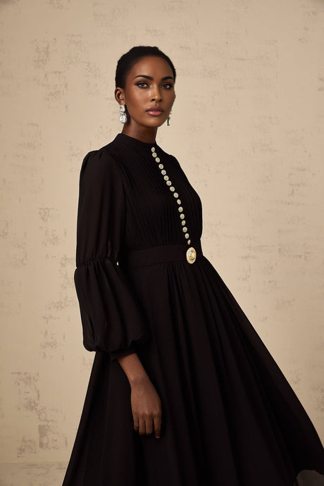Black pleated midi dress with button front detail named Viviane