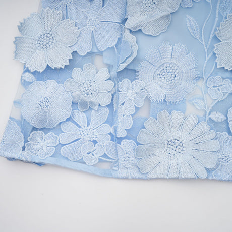 Blue midi dress with floral applique details by Herta
