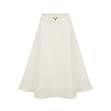 Elegant neutralcolored matching set featuring a top and skirt with delicate 3D petal details