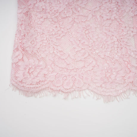 Elegant pink midi dress featuring floral embroidery and lace detailing with embellishments