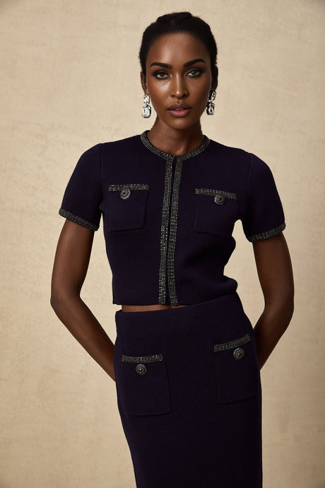 Heres a simple alt text for the product image based on the given title

Woman wearing matching ribbed knit top and skirt set with embellishments in Aida style