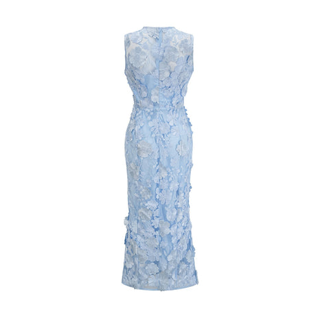 Herta blue dress with floral appliques reaching mid calf length on model against plain background