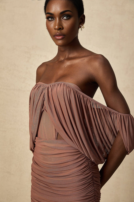 Two piece matching set featuring an offshoulder bodysuit and skirt in Zohra style