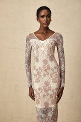 White fitted midi dress with intricate guipure lace pattern long sleeves high neckline and scalloped hem