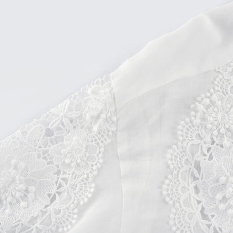 White long sleeve shirt with lace embroidery detailing and cut out design on shoulders