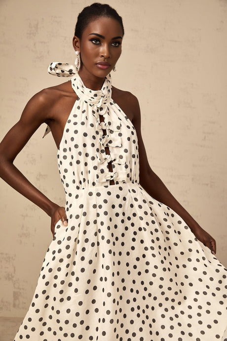 White midi dress with polka dot pattern and bow detail named Audrey