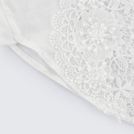 White shirt with lace embroidery and cut out details