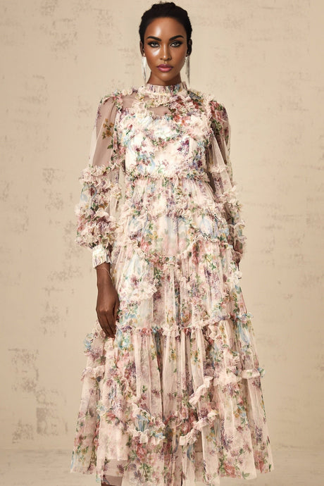 Woman wearing a floral patterned midi dress with ruffled tulle details and a fitted waist