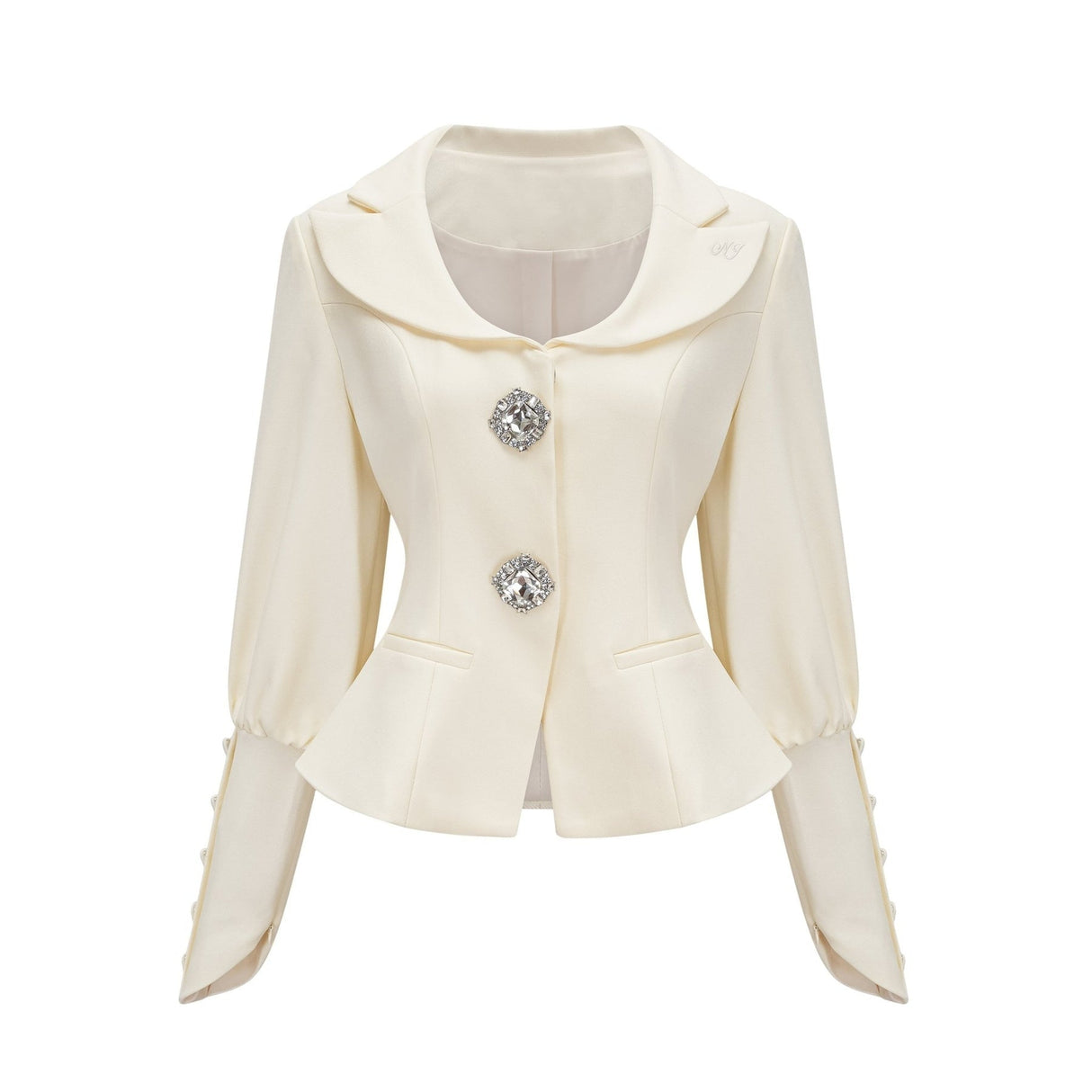 Woman wearing a matching jacket and shorts set embellished with crystal details The outfit has a glamorous and sparkly appearance