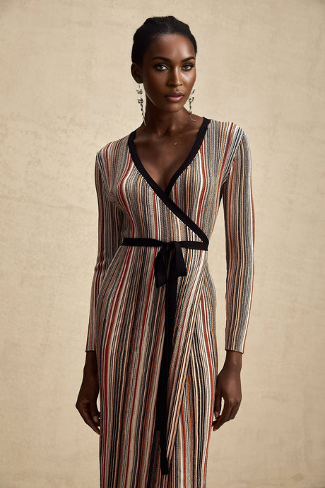Woman wearing a striped metallic midi dress with a wrap design named Adele