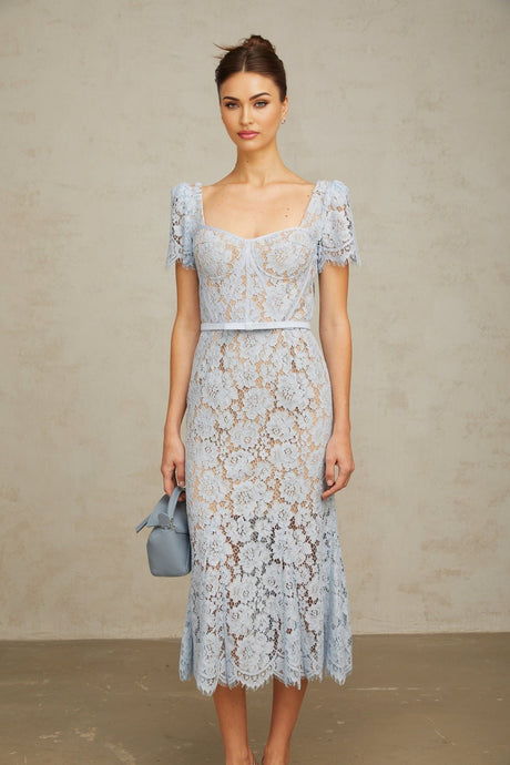 Woman wearing blue floral lace midi dress with boned bodice and delicate straps