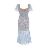 Woman wearing blue floral lace midi dress with boned bodice and fitted silhouette