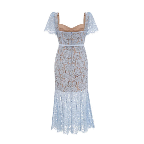 Woman wearing blue floral lace midi dress with boned bodice and fitted silhouette