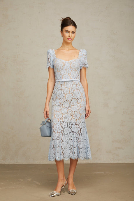 Woman wearing blue floral lace midi dress with boned bodice and sweetheart neckline
