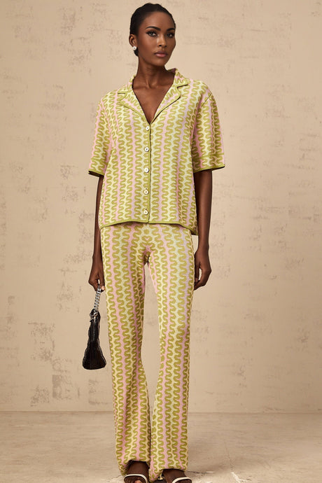 Woman wearing green color block knitted shirt and matching trousers set named Ophelie