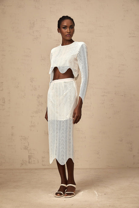 Woman wearing white wavy woven matching top and skirt set named Constance